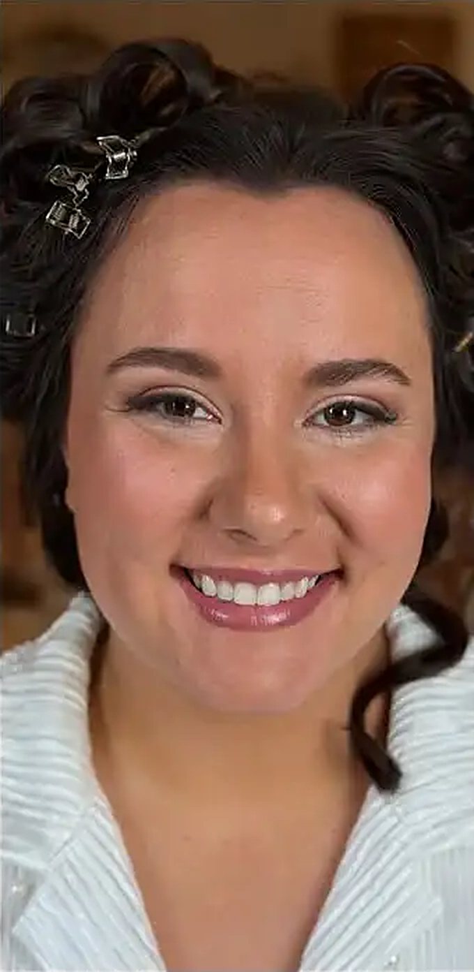Airbrush makeup with a soft pink lip, eyes open