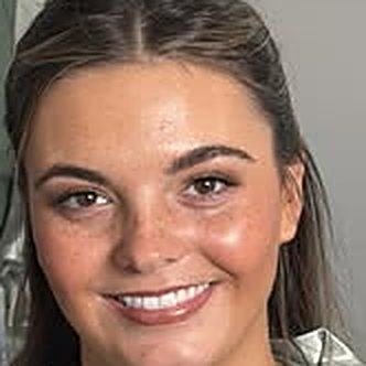 Smiling client with glowy airbrush makeup