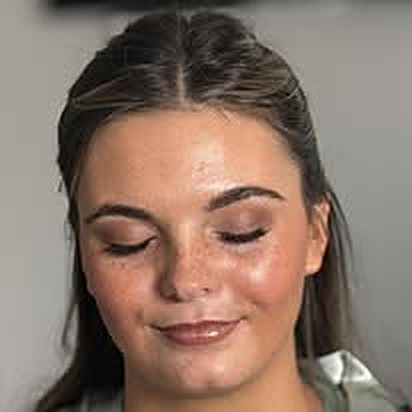 Close-up of a glowy airbrush finish, eyes closed