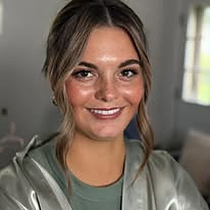 Client with bronzed glam and face-framing waves